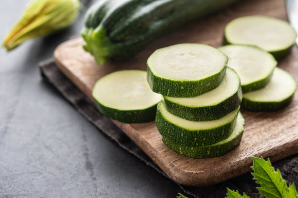 Fresh zucchini on wooden table close up. Copy space. stock photo