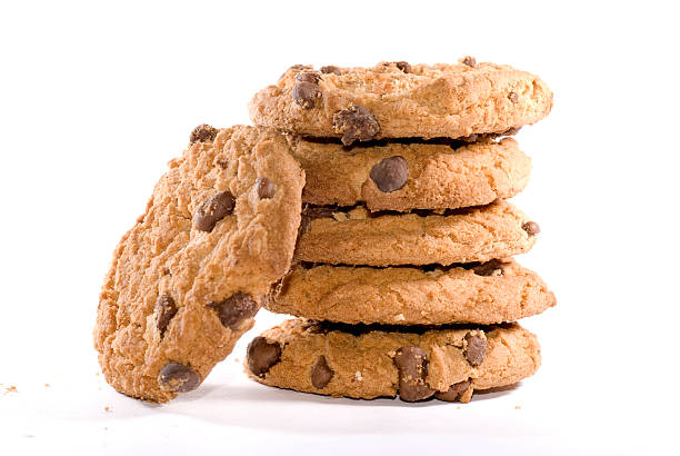 freshly baked chocolate chip cookies stack of delicious chocolate chip cookies cookie photos stock pictures, royalty-free photos & images