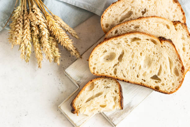 Freshly baked homemade artisan sourdough bread. Sliced. Top view. Copy space. Freshly baked homemade artisan sourdough bread. Sliced. Top view. Copy space. artisanal food and drink stock pictures, royalty-free photos & images