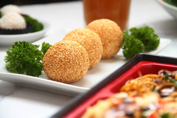 Freshly made Chinese dessert food called Buchi or Sesame balls with sweet filling stock photo