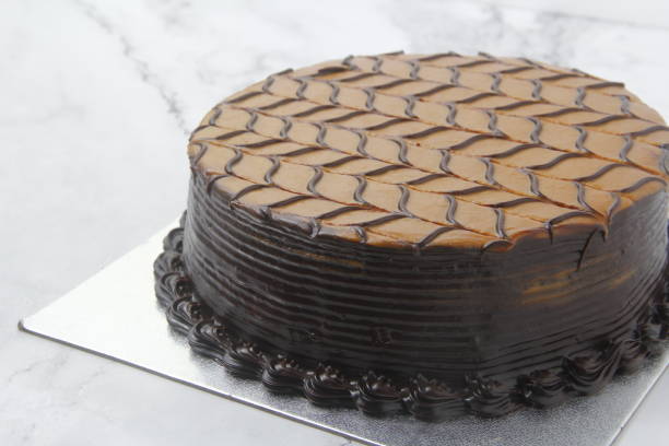 Freshly made chocolate caramel cake stock photo
