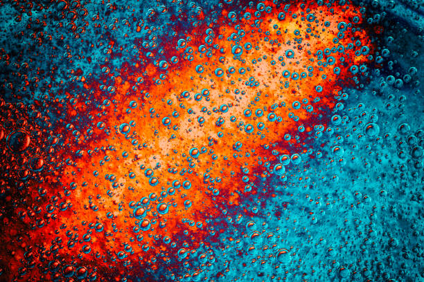 Freshness. Imaginary volcano eruption in the bottom of the ocean. Blue and orange abstract texture photo. nuclear fusion stock pictures, royalty-free photos & images