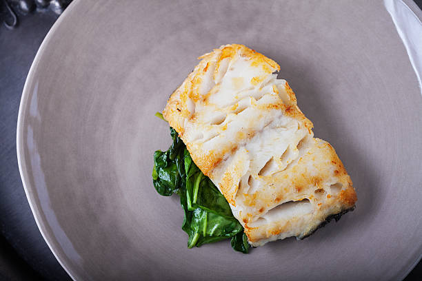 Fried cod fillets and spinach