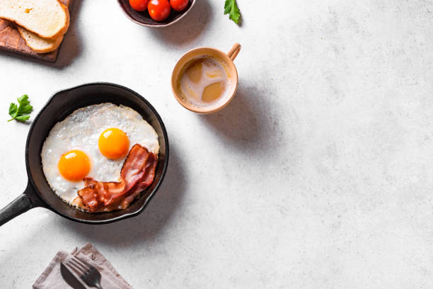 Fried eggs and bacon stock photo