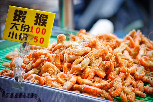 Fried shrimp at night market, Taipei, Taiwan "Fried shrimp at night market, Taipei, Taiwan." taiwan food prawn snack stock pictures, royalty-free photos & images