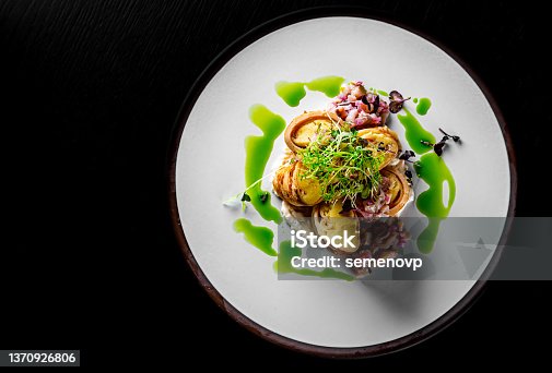 istock fried thin pancakes crepe stuffed potato with herring fish in plate 1370926806