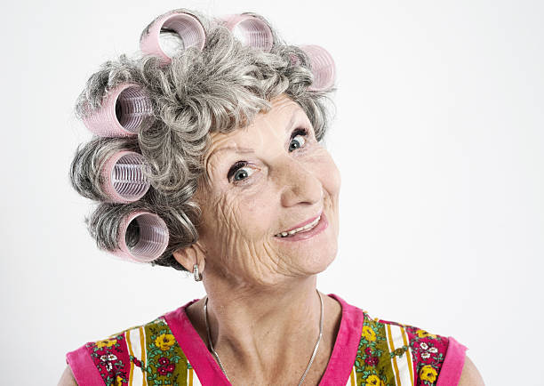 Friendly elderly housewife "Steriotype housewife, 68 years old, with curlers in her hair.Other photos of this model:" ugly old women stock pictures, royalty-free photos & images