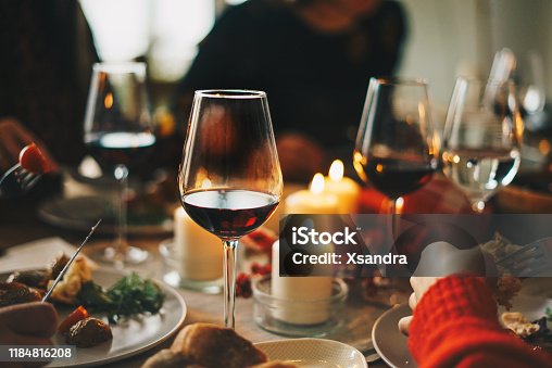 istock Friends enjoying a Christmas dinner together 1184816208
