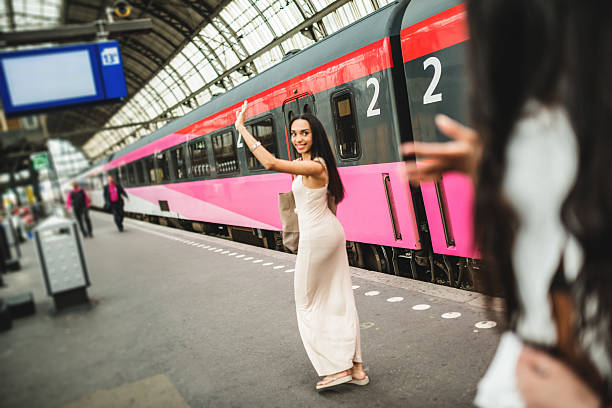 friends greetings on the amsterdam station  wave goodbye asian stock pictures, royalty-free photos & images