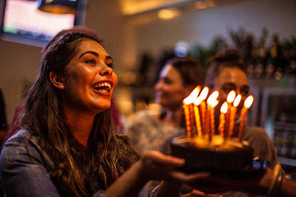 Friends having a lot of fun at birthday party stock photo