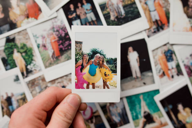 Friends on Holiday Instant Film Montage Flat lay montage of instant film photos of friends on vacation in Tuscany, Italy. One of the images is being held up close to the camera. flat lay photos stock pictures, royalty-free photos & images