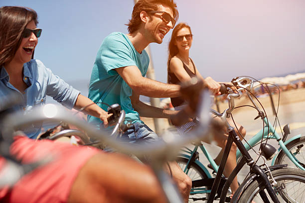 friends riding bicycles together - friends riding bildbanksfoton och bilder