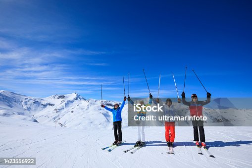 istock Friends Senior group , Men snow skier skiing, enjoying on sunny ski resorts. Skiing  against blue sky. 1423556922
