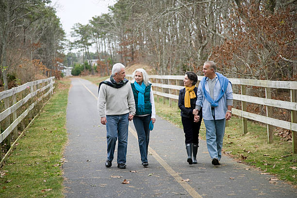 Friends walking along path  50 59 years photos stock pictures, royalty-free photos & images