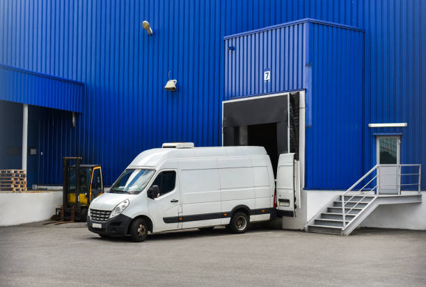 from in loading van in loading and unloading commercial cargo in warehouse dock mini van stock pictures, royalty-free photos & images