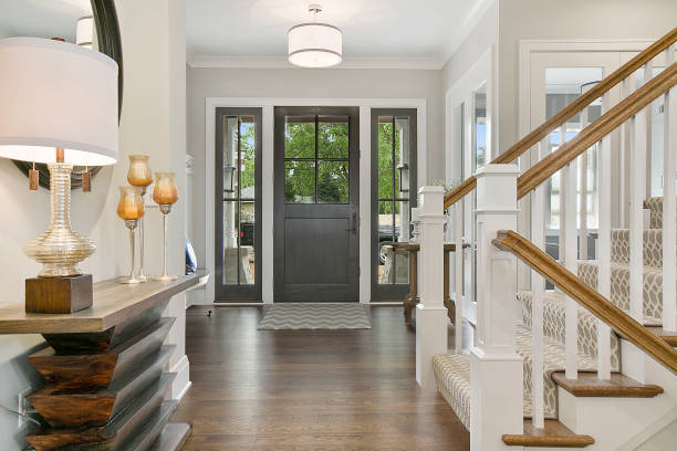 Front door of home with beautiful floor plan design Wonderful decor and detail in newly built home entrance hall stock pictures, royalty-free photos & images