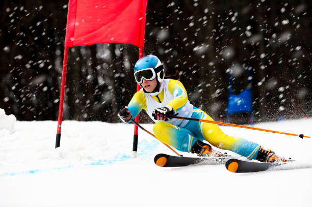 Front View of Female Skier at Giant Slalom Ski Practice during Snowing stock photo