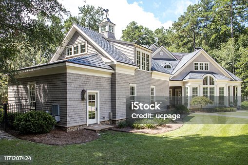 istock Front view of large cape cod style home with custom feautures 1171207424