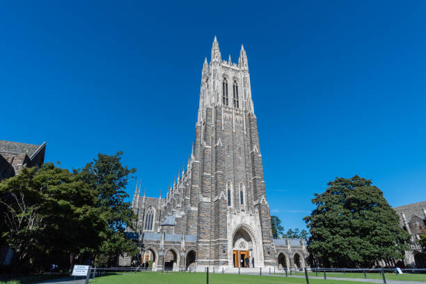 Front view of the Duke Chapel tower in early fall, Durham, North Carolina Front view of the Duke Chapel tower in early fall, Durham, North Carolina chapel stock pictures, royalty-free photos & images