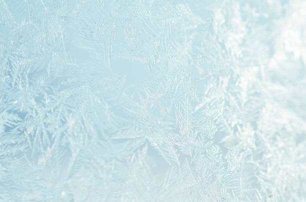Photo of Frosty natural pattern on winter window.