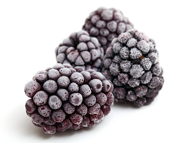 frozen blackberries frozen blackberries isolated on white background frozen water stock pictures, royalty-free photos & images
