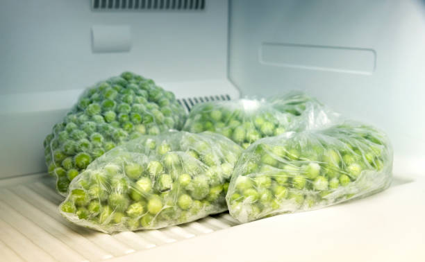 Frozen Sweet Peas Inside Deep Freezer stock photo