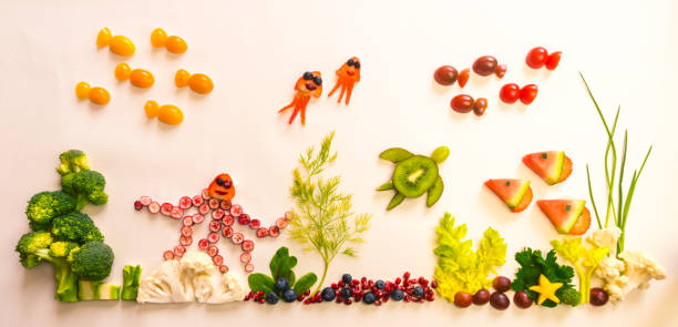 fruit and vegetable creative ideas, sea world fantasy in vivid colors stock photo
