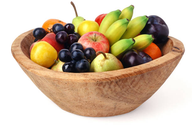 fruit bowl isolated Wooden fruit bowl isolated over white background bowl photos stock pictures, royalty-free photos & images