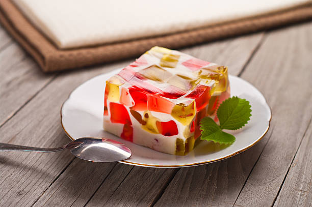 fruit dairy, red and green jelly on a plate. fruit dairy, red and green jelly on a plate gelatin stock pictures, royalty-free photos & images