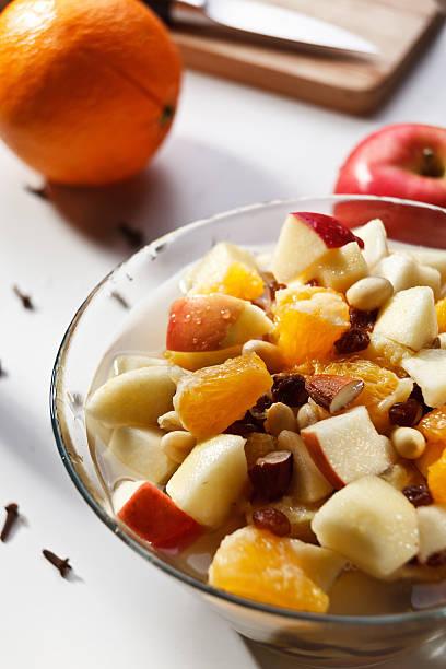 Fruit salad with almond and peanut stock photo