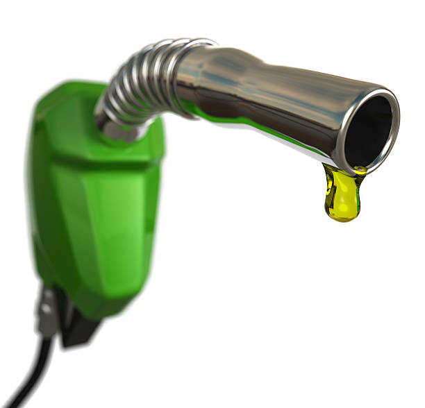 Fuel Crisis A fuel pump nozzle with a drop of petrol. Very high resolution 3D render. bowser stock pictures, royalty-free photos & images