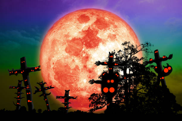 Full blood moon and silhouette tree on night sky with ghosts Full blood moon and silhouette tree on night sky with ghosts, Elements of this image furnished by NASA, https://spacewatch.global/2018/12/new-space-moon-race-nasa-taps-nine-u-s-companies-for-commercial-lunar-payload-services/ blood moon stock pictures, royalty-free photos & images