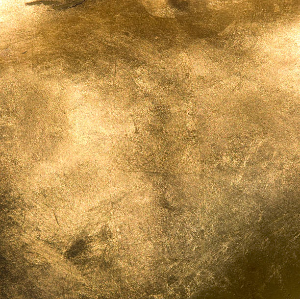 Full Frame Gold Close Up Full frame Gold background. The gold in the image is shiny and has a lot of texture and colors. foil material stock pictures, royalty-free photos & images