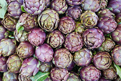 Full frame shot of purple artichokes for sale at Greengrocer's Shop in market