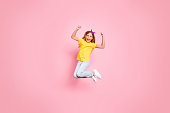 Full length body size view of her she nice attractive lovely carefree, ecstatic cheerful cheery pre-teen girl wearing yellow t-shirt having fun rejoicing isolated over pink pastel background