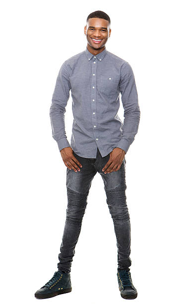 Full length portrait of a cool black guy smiling Full length portrait of a cool black guy smiling on isolated white background model object stock pictures, royalty-free photos & images