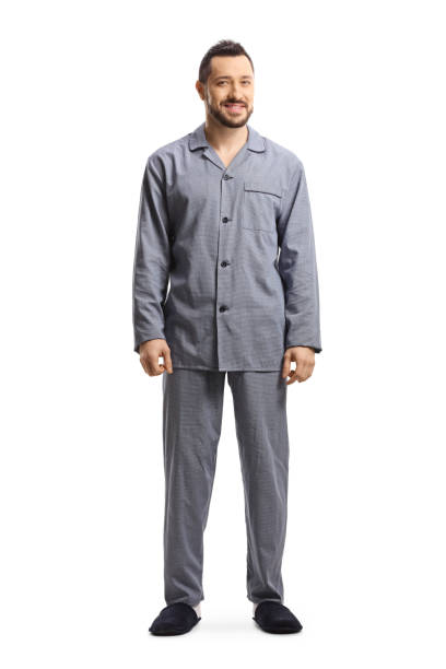 Full length portrait of a man in pajamas standing stock photo