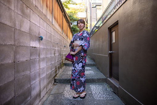 Japanese woman in Yukata having solo trip to Kagurazaka for blogging and vlogging