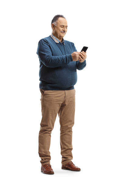 Full length shot of a mature man using a smartphone Full length shot of a mature man using a smartphone isolated on white background fat man looks at the phone stock pictures, royalty-free photos & images