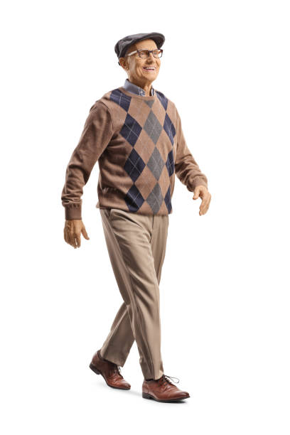 Full length shot of an elderly gentleman walking and smiling stock photo