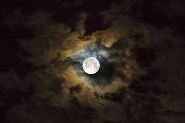 Full moon amongst thunderclouds stock photo