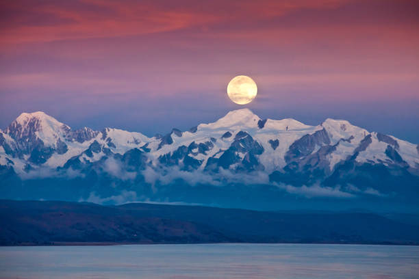 Photo of Full moon at Lago Titikaka with Cordillera Real Bolivia