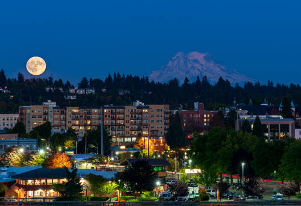 Full Moon Over City With Mountain stock photo