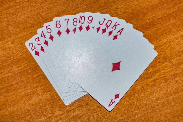 A full set of diamonds in Playing card laying on the table with an different arrangement. stock photo