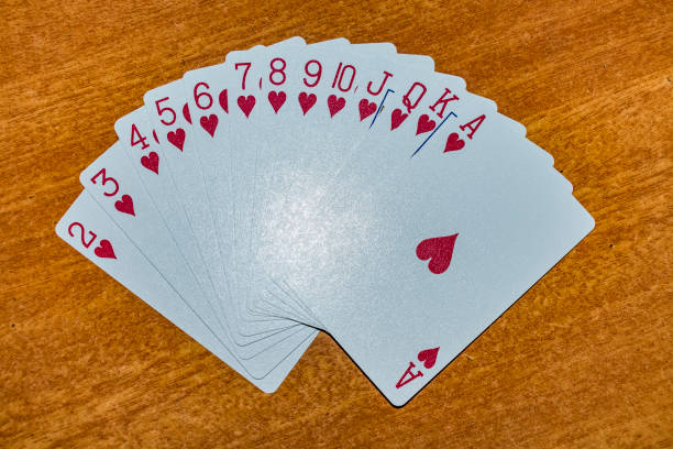 A full set of hearts in Playing card laying on the table with an different arrangement. stock photo
