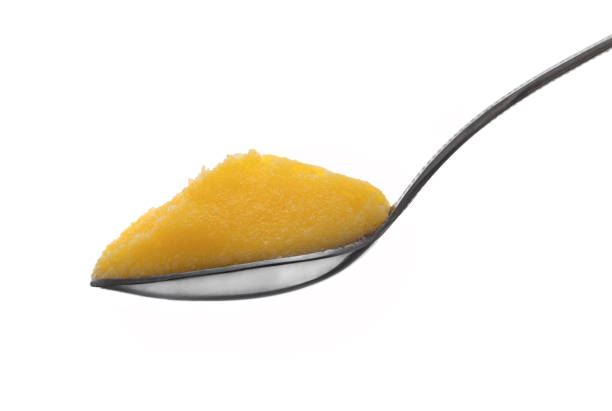 Full Spoon of Pure Indian Ghee Full Spoon of Pure Indian Ghee Isolated on White Background ghee stock pictures, royalty-free photos & images