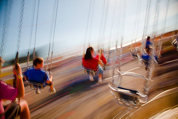 Fun at the fair Mechanical rides at the annual North Carolina State Fair zero gravity carnival ride stock pictures, royalty-free photos & images