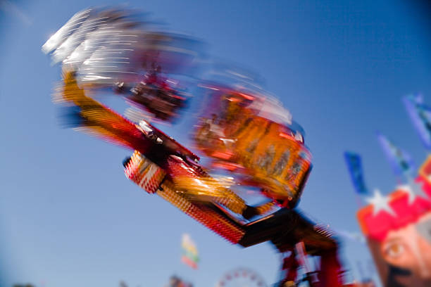 Fun at the fair Mechanical rides at the annual North Carolina State Fair zero gravity carnival ride stock pictures, royalty-free photos & images