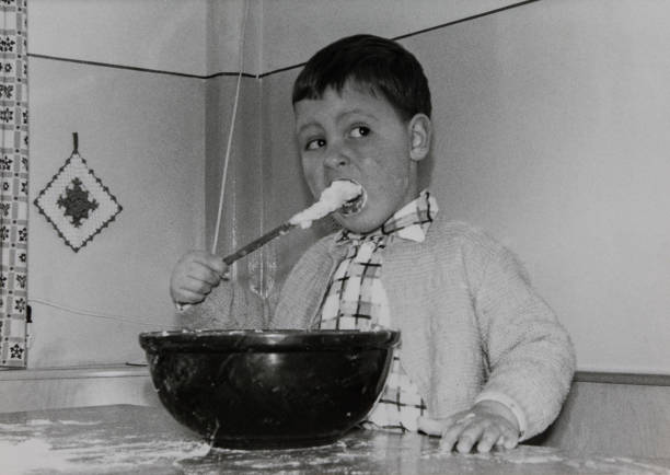 Fun for children in 1962, baking Christmas cookies. stock photo