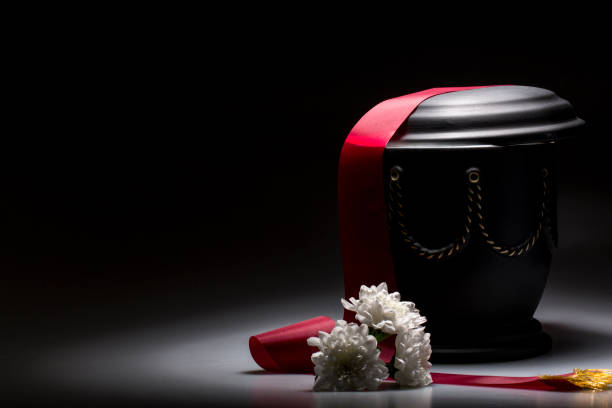 funeral mourning urn, for obituary funeral urn, with tape and flower decorated, for sympathy, card cremation stock pictures, royalty-free photos & images